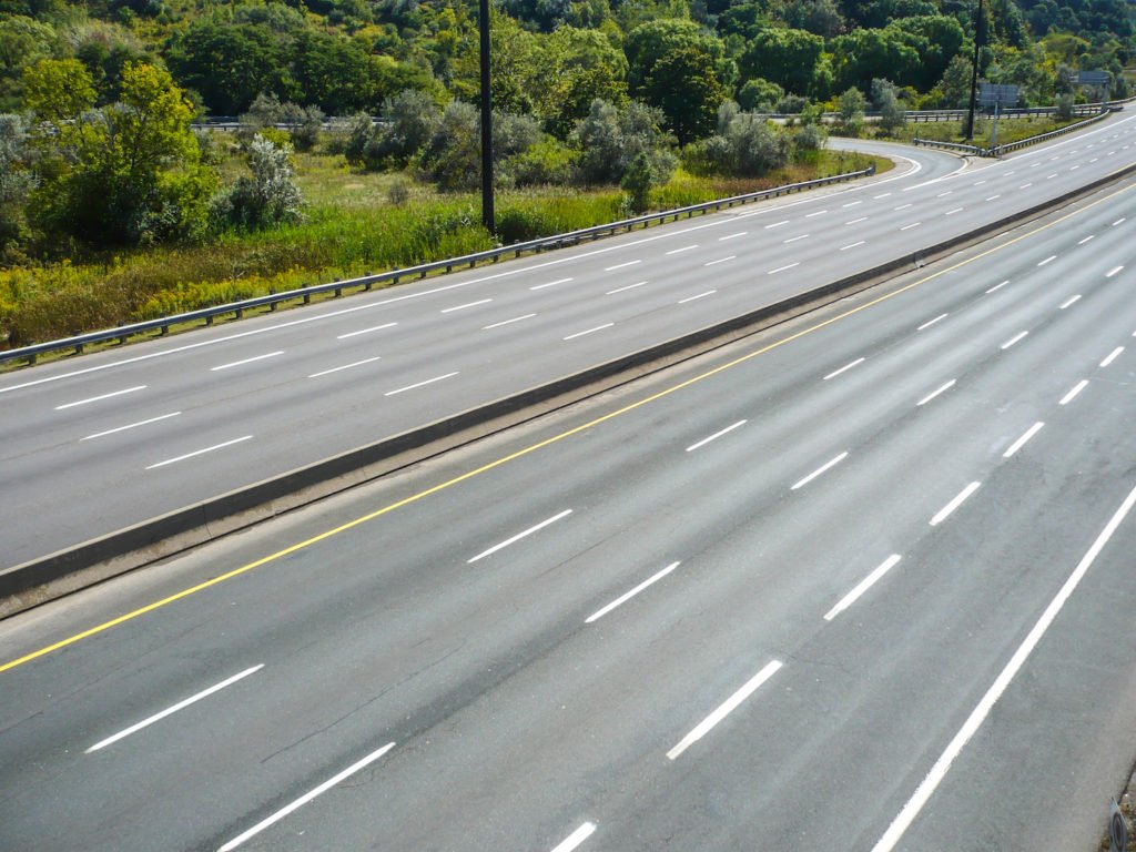A divided highway, where drivers must keep to the right side of the median.