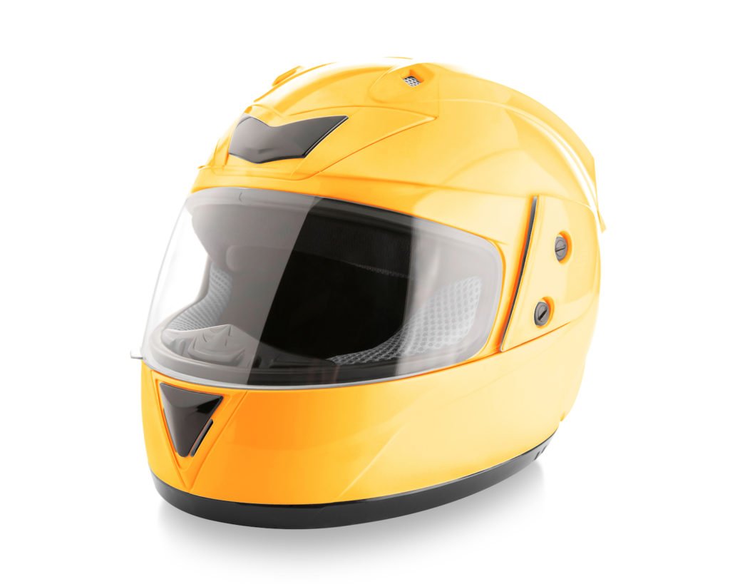 Yellow motorcycle helmet against white background