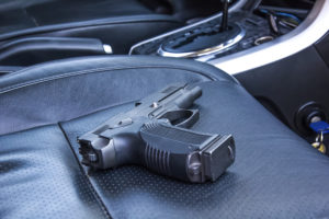 Loaded handgun on passenger seat in car, which is legal in Colorado under CRS 33-6-125.