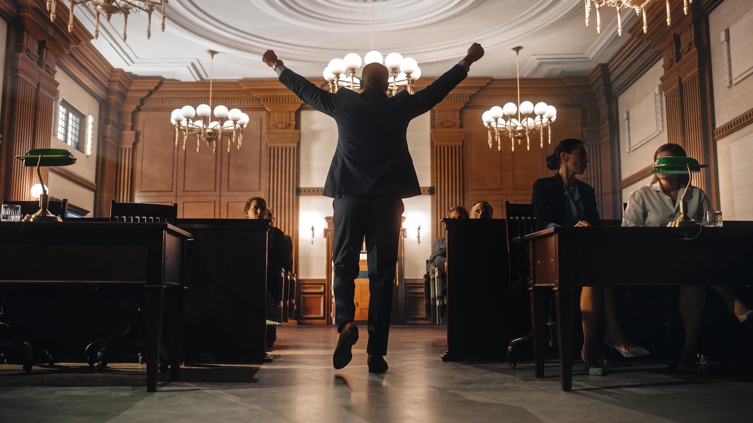 Man pumping his fists in victory in a courtroom after getting a Colorado record seal
