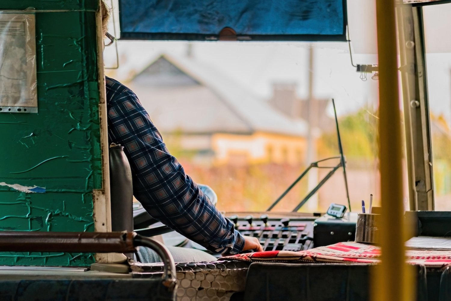 Bus driver on a dreary day after being harassed by a passenger