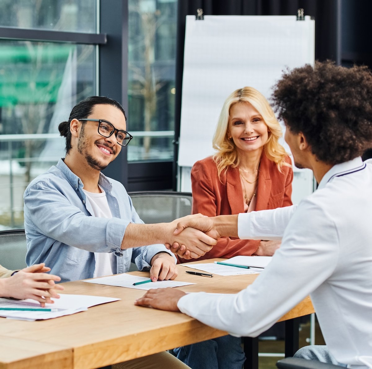 Job interview with the interviewer and interviewee shaking hands