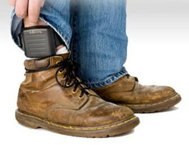 Man with electronic monitoring ankle bracelet 
