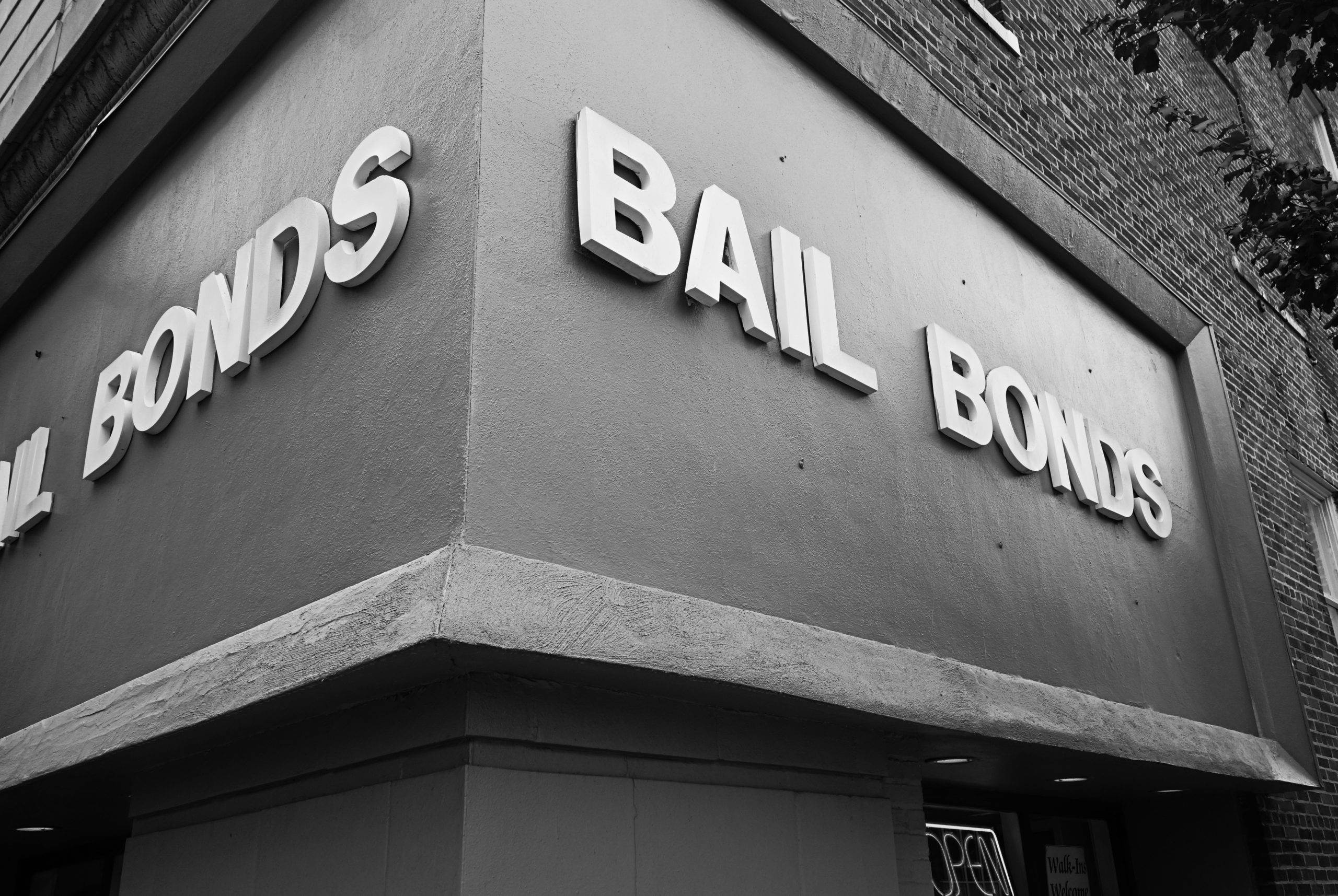 Grey office building that says "bail bonds" in white letters outside