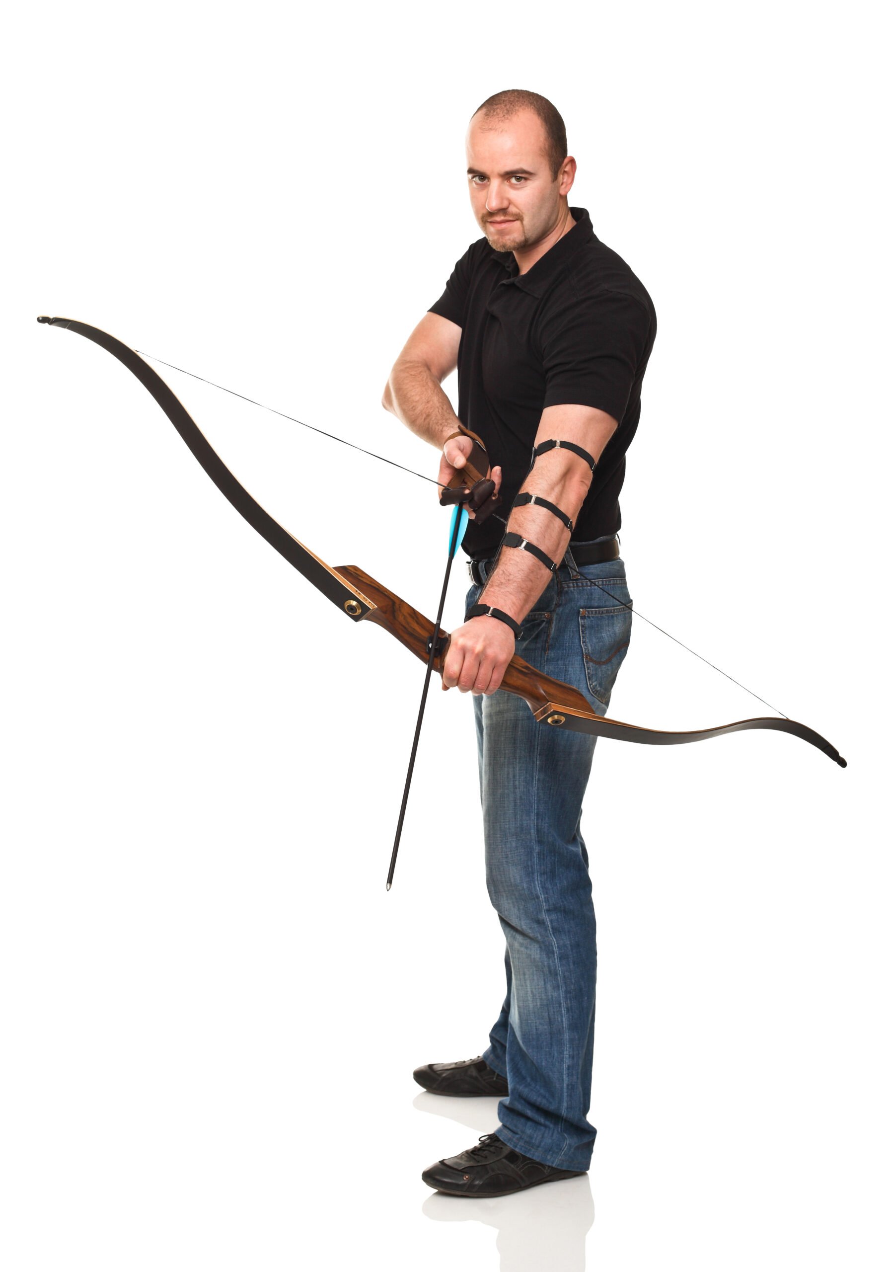 Man holding a bow and arrow against white background