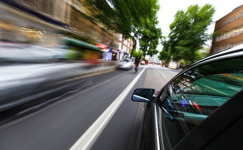 Car speeding on street in violation of CRS 42-4-1101.