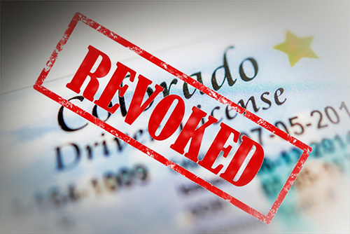 Colorado revoked license, which prohibits the license-holder from driving.