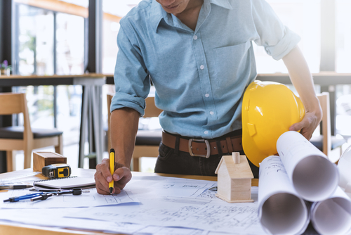 hard hat and plans