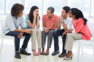 Group counseling session with one counselor and four patients who were ordered to attend as part of probation