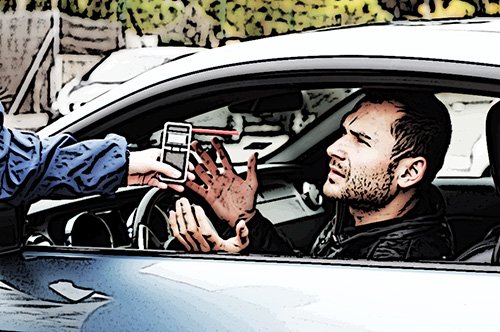 A traffic stop, where the driver is resisting taking the breathalyzer test the police officer is holding out to him