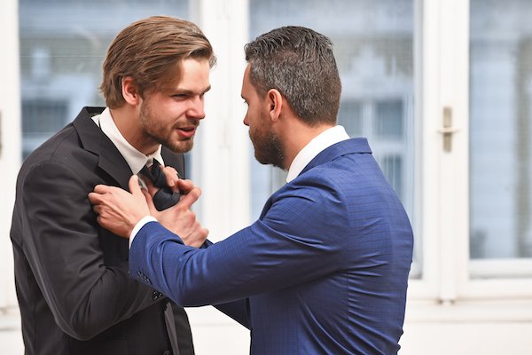 A man physically assaulting a public servant to keep him from doing his job, which violates CRS 18-8-102 in Colorado.