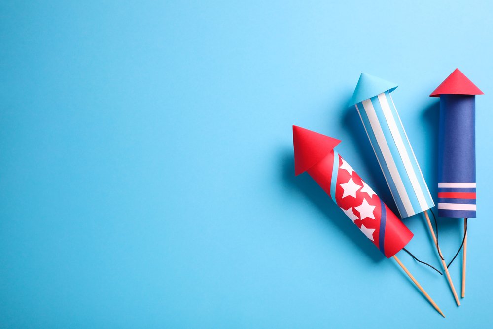 A graphic of unexploded fireworks against a light blue background
