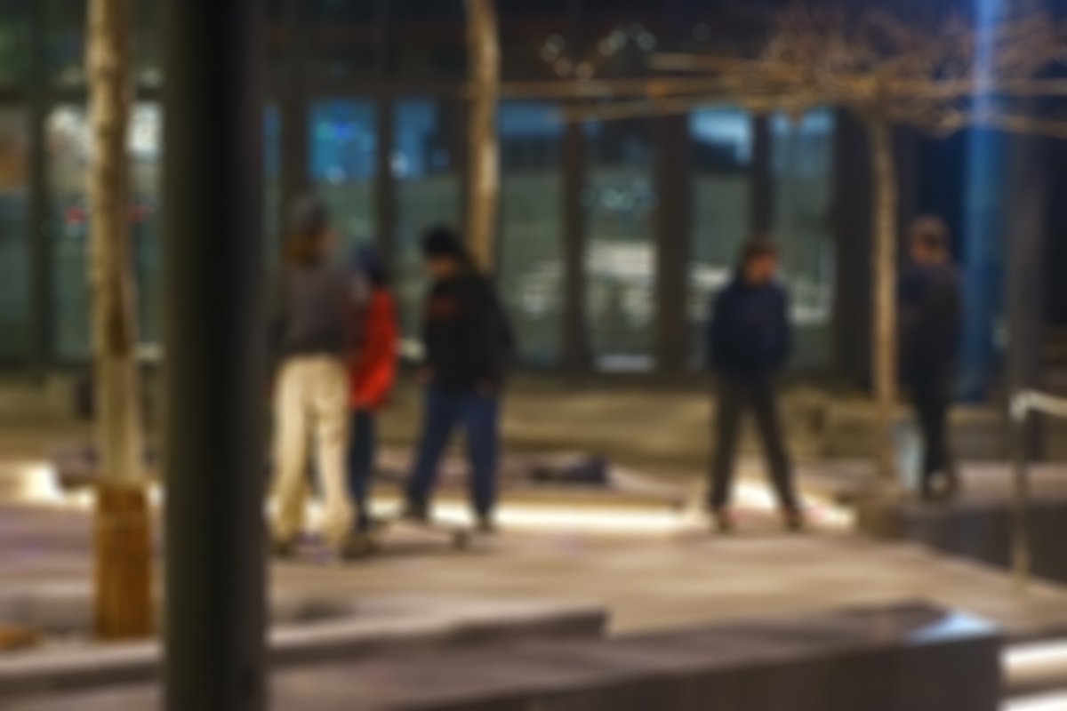Blurry photo of criminal street gang at night