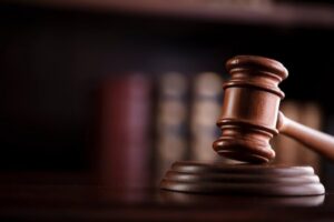 Judge's gavel in front of law books