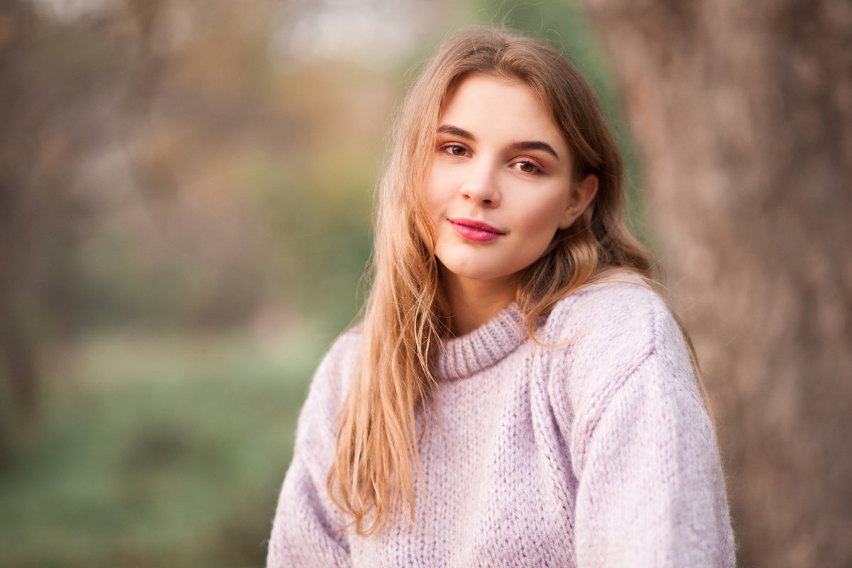 Mature-looking teenage girl outside