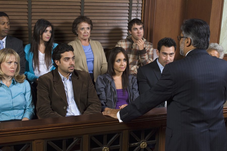 Prosecutor talking to an assembled grand jury about the suspect they have to decide whether to indict