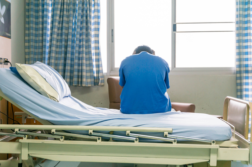senior on hospital bed during involutary commitment