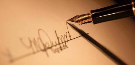 Close-up of forged signature on a job application, which is a type of 2nd-degree forgery under CRS 18-5-104.