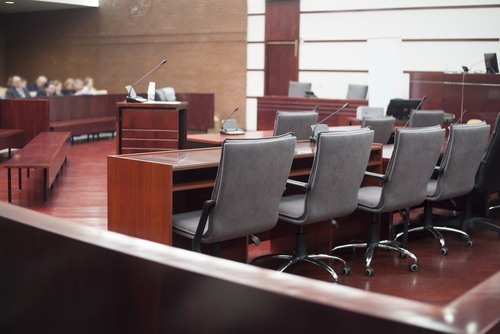 Courtroom where a grand jury in convened to determine whether to indict the suspect
