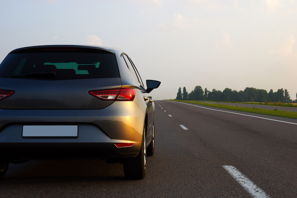 Car about to change lanes. Since there is no other traffic nearby, the lane change would not be in violation of Colorado traffic laws. 