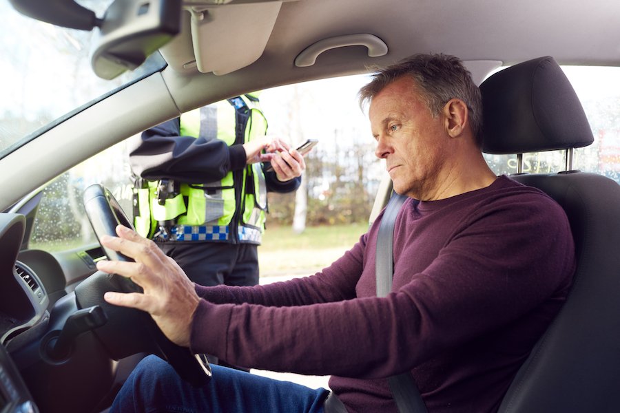 Man after being pulled over looking angry