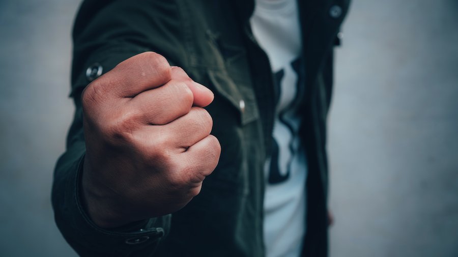 Man making fist at someone as an example of "menacing" per Colorado CRS 18-3-206