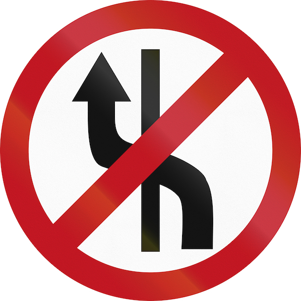 A traffic sign prohibiting changing lanes. Defying this sign is a CRS 42-4-1007 violation.