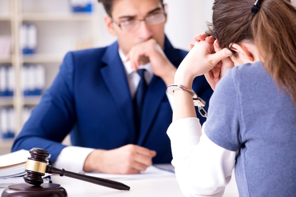 An attorney with his client, possibly during a parole rescission hearing.