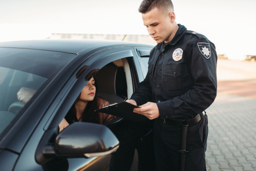 police officer issuing a traffic ticket
