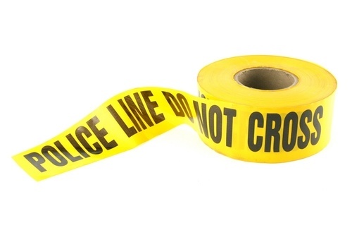 Yellow police line tape against a white background