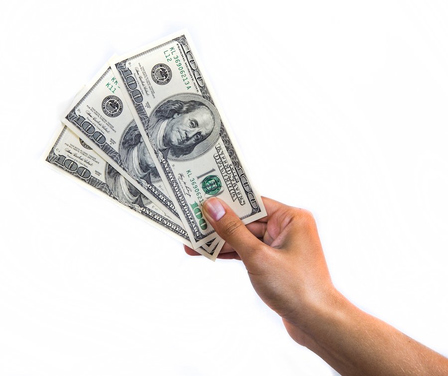 Hand holding $300 to signify the costs of sealing arrest records that do not result in a charge