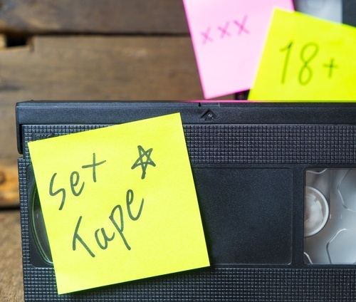 VHS with post-it note that says "sex tape"