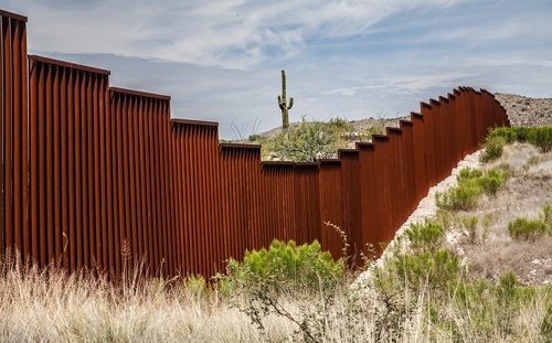 Border wall between the U.S. and Mexico - human smuggling in violation of immigration laws is a crime under CRS 18-13-128