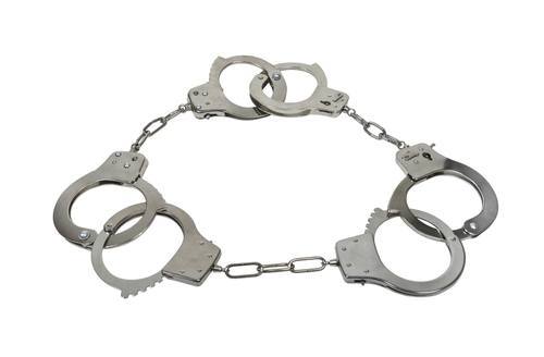 Set of 3 inter-linked handcuffs to illustrate "Three Strikes"