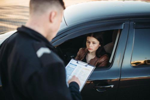 Police officer issuing citation, which can lead to being a classified as an habitual traffic offender