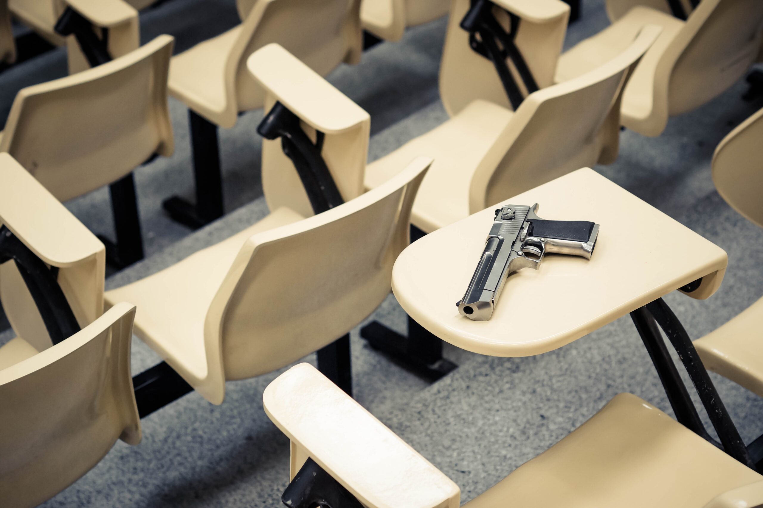 Gun on desk at school as an example of a CRS 18-12-105.5 violation