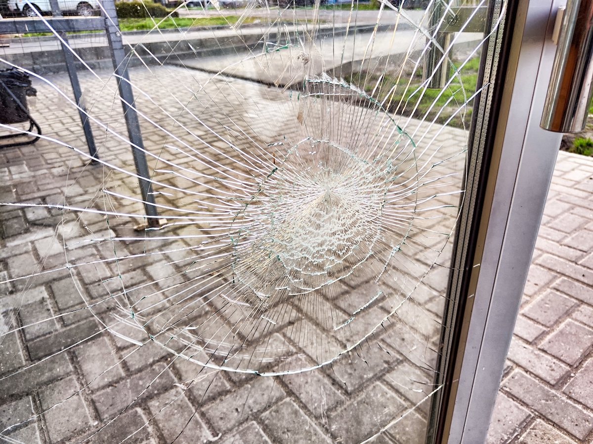 Broken window following an act of criminal mischief