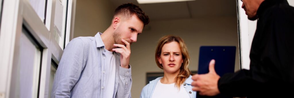 Police questioning a couple who is hiding a criminal 